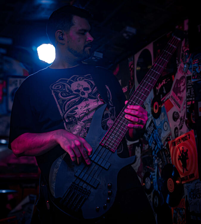 Paul crafting the foundations Paul playing bass